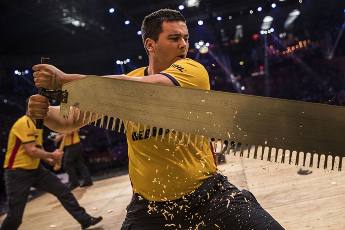 Team Romania performs during the Team Competition of the Stihl Timbersports World Championships at the Porsche-Arena in Stuttgart, Germany on November 11, 2016.